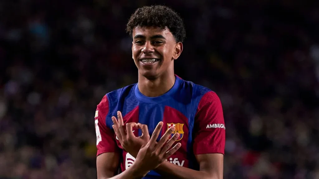 Barcelona player Lamine Yamal celerating his goal against Granada